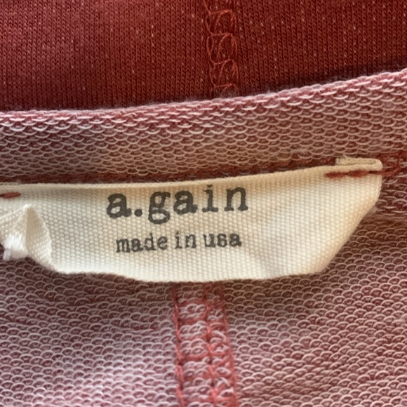 NWOT. Woman’s two tone long sleeve boatneck style top with cut out shoulders. - Picture 8 of 8